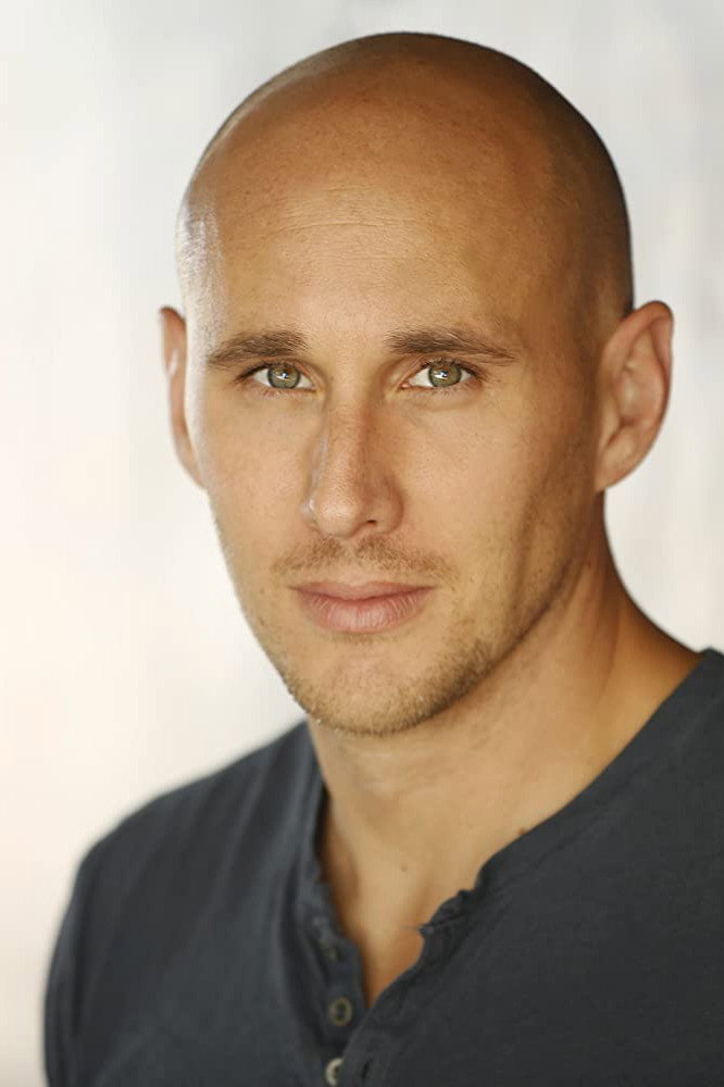 Josh Wingate as Gun Salesperson in Dark Skies