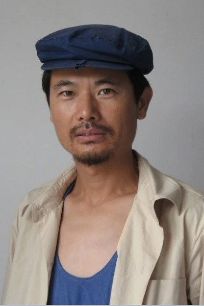 Yiran Tuo as Zhang Wentian in The Legend of 1935