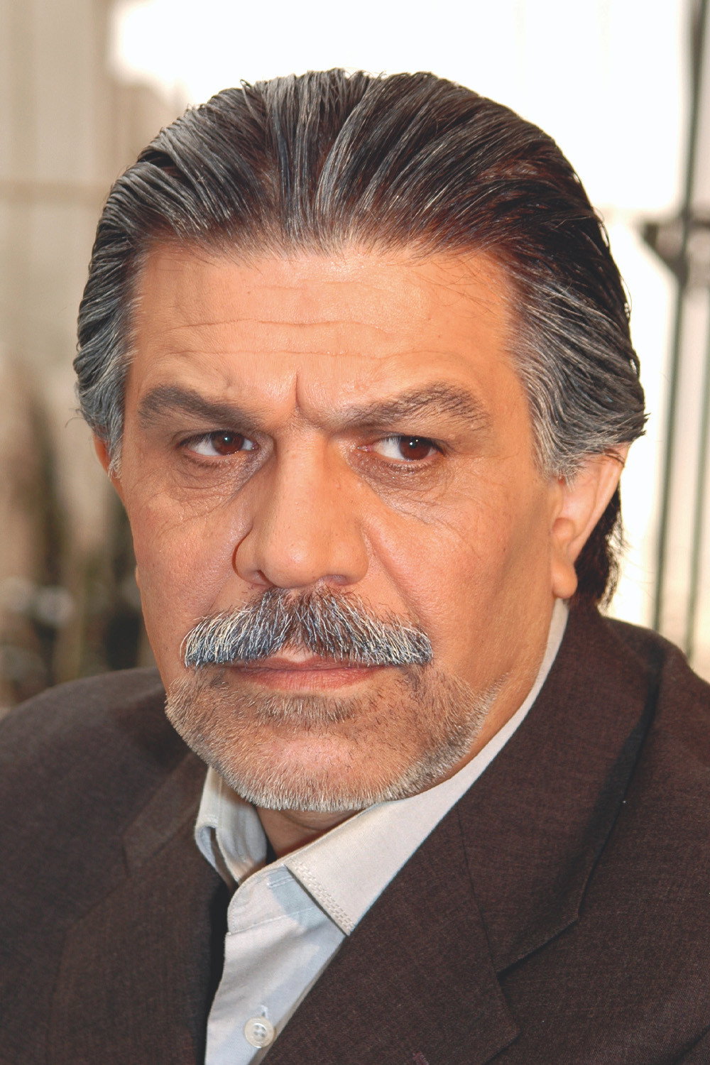 Parviz Fallahipour as Nosrat Pashaei in Shahrzad