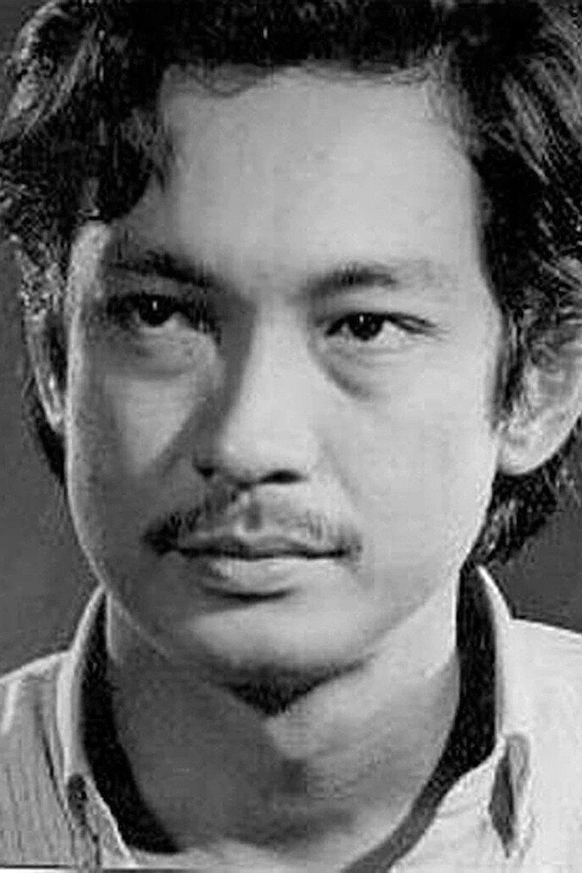 Nguyễn Chánh Tín as Robert Nguyễn Thành Luân in Cards on the Table: Wreath on the Grave