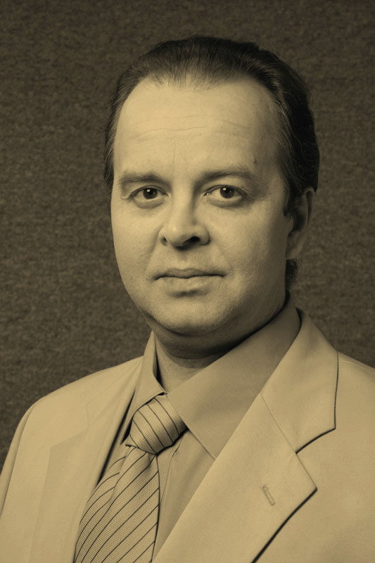 Вячеслав Беляев as Всеволод Дурыгин сельс. учитель, в прошлом генетик in Чёрные волки