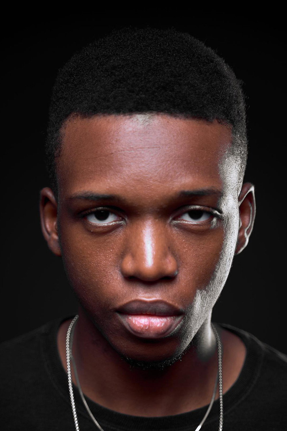 Akintoba Adeoluwa as Debo in Tiger's Tail