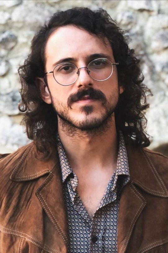Gianluca Colucci as Gianluca "Fru" in Pesci Piccoli: Un' agenzia, molte idee, poco budget