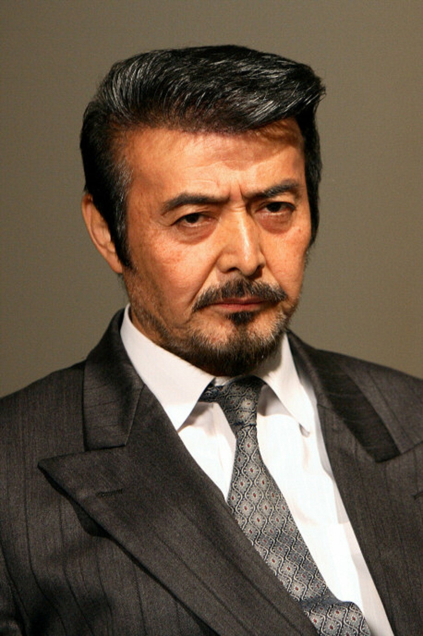岡崎二朗 as Yabuki in Nihon Yakuza Kososhi