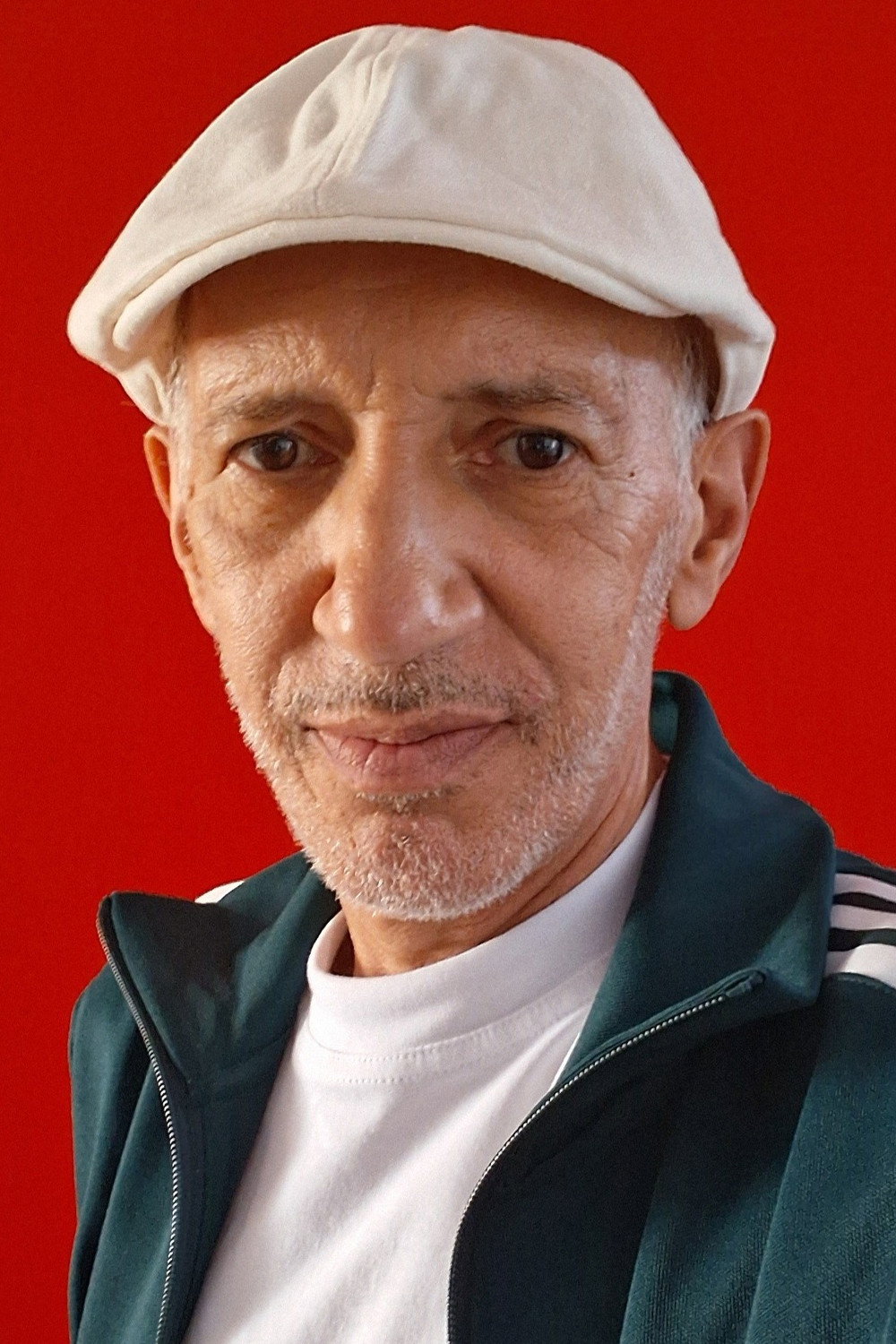 Abdel Baki Bousmaha as The Father in Pale Sun