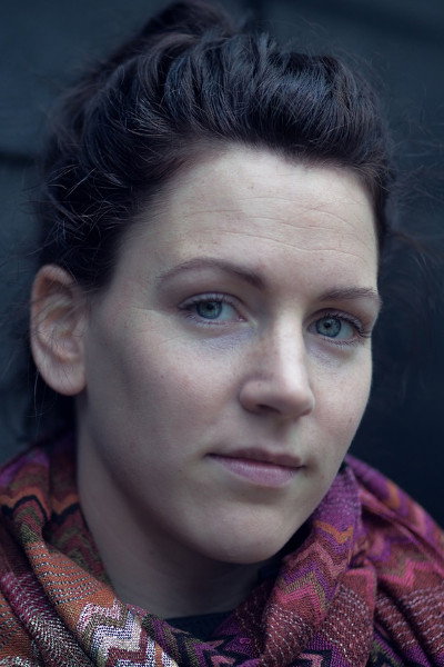 Linda Jacobsen as Ambassador in Welcome to Earth