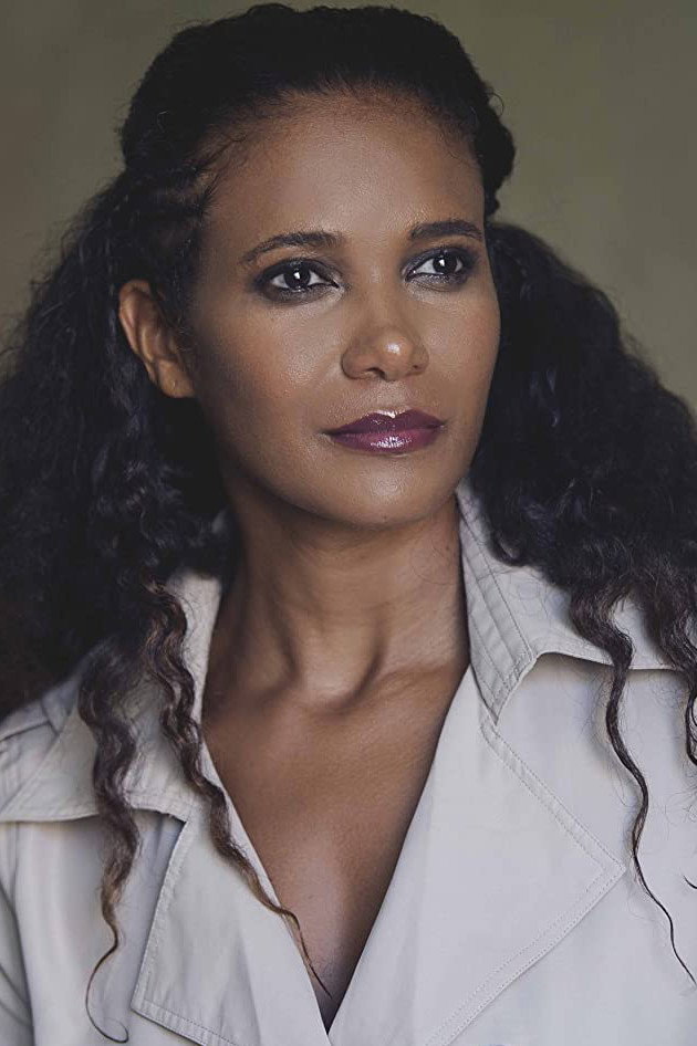 Denny Mendez as Esther in Global Harmony