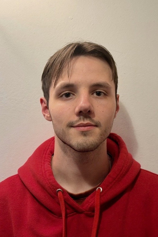 Jacob Wright as Sam in GREED