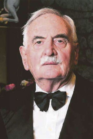 John Sharp as The Manager in The Renata Road