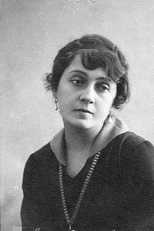 Elizaveta Time as Elena Sergeevna in A Day of Sun and Rain