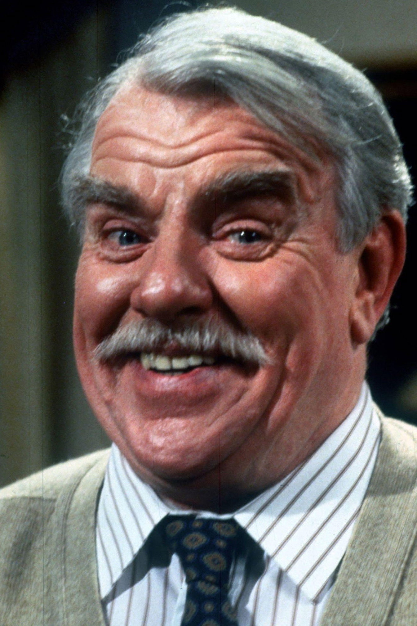Windsor Davies as Mr. Henry Truscott in Confessions of a Driving Instructor