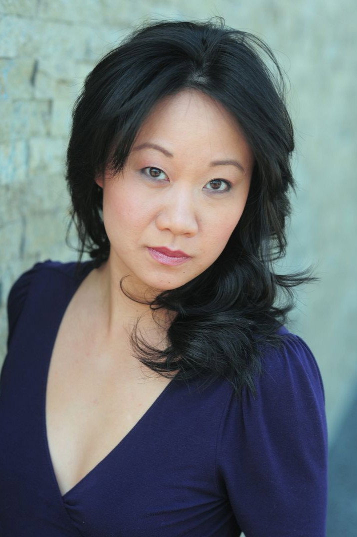 Elaine Ann Hu as Officer Xi'an in 5th Passenger