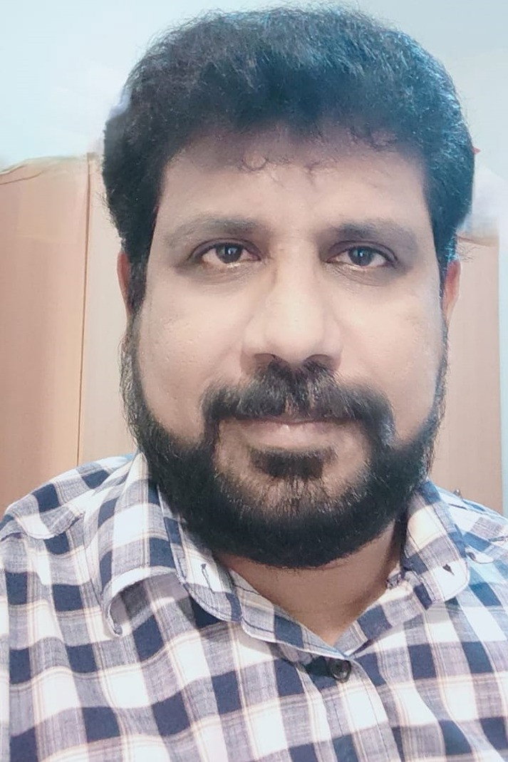 Roji Mathew as Roji in I Am a Father