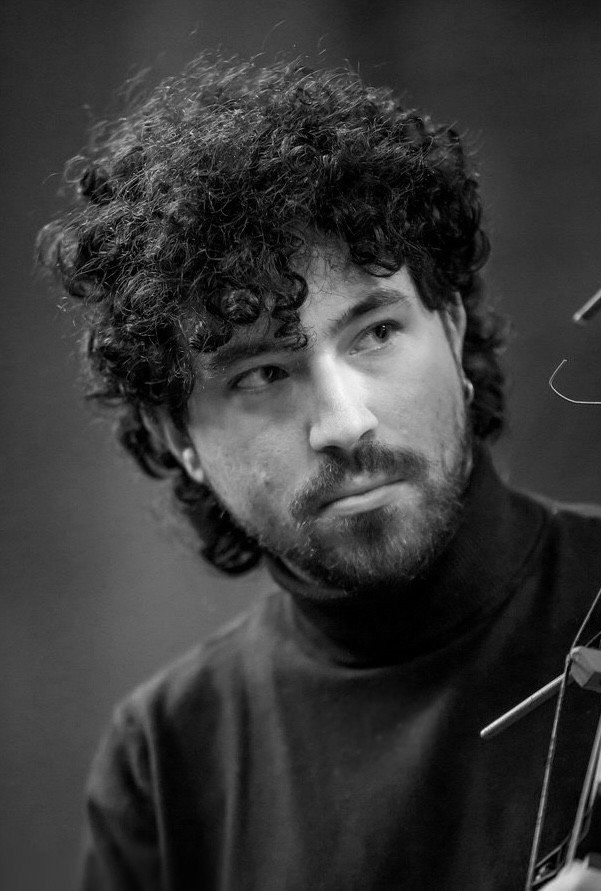 Adam Paroussos as Ambrose in The Golden Squacco Heron