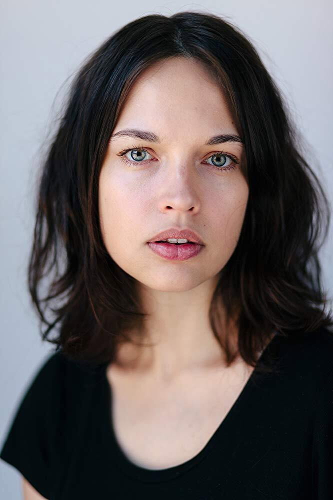 Aggy K. Adams as Mia in The Couple Next Door