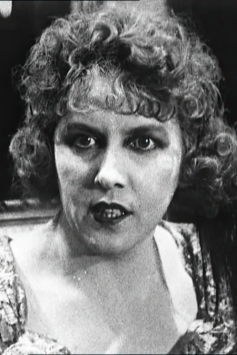 Maud Richard as Madame Mallet in Backbiters
