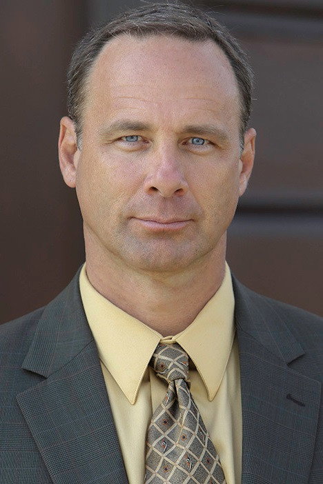 Brian Oblak as Father Overman in Blackstone