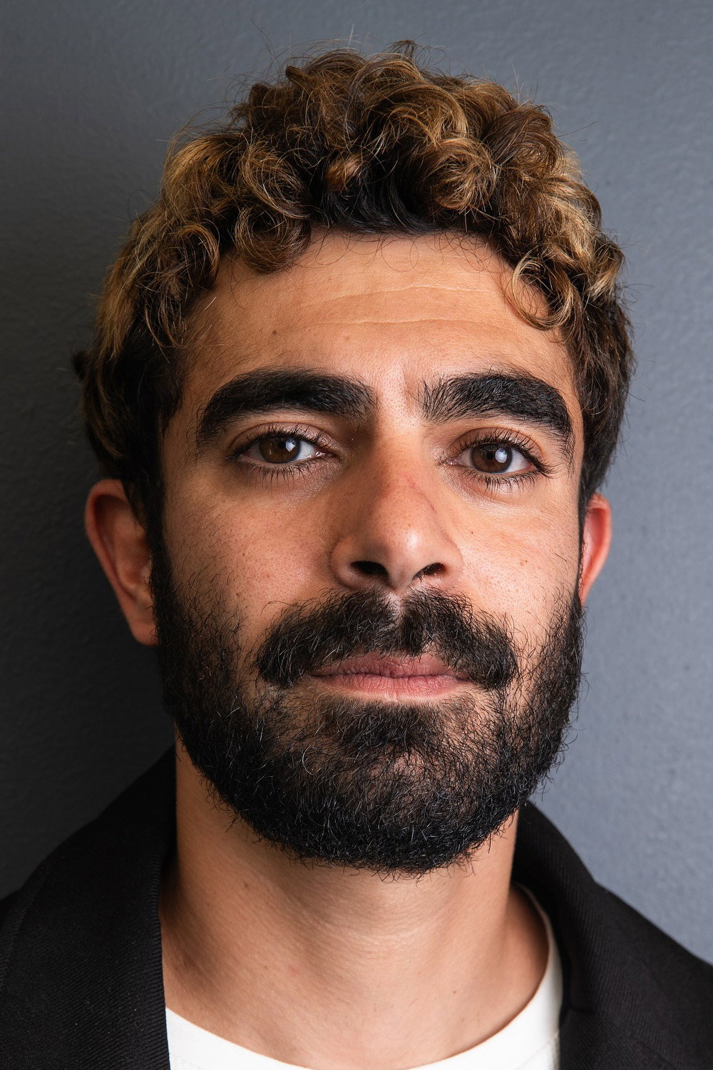 Hassan Akil as Nino in A Sad and Beautiful World