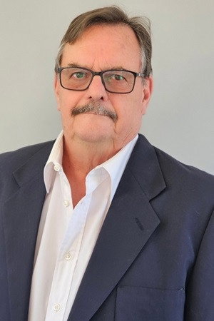 Jakkie Groenewald as Pub Owner in Bunny Chow