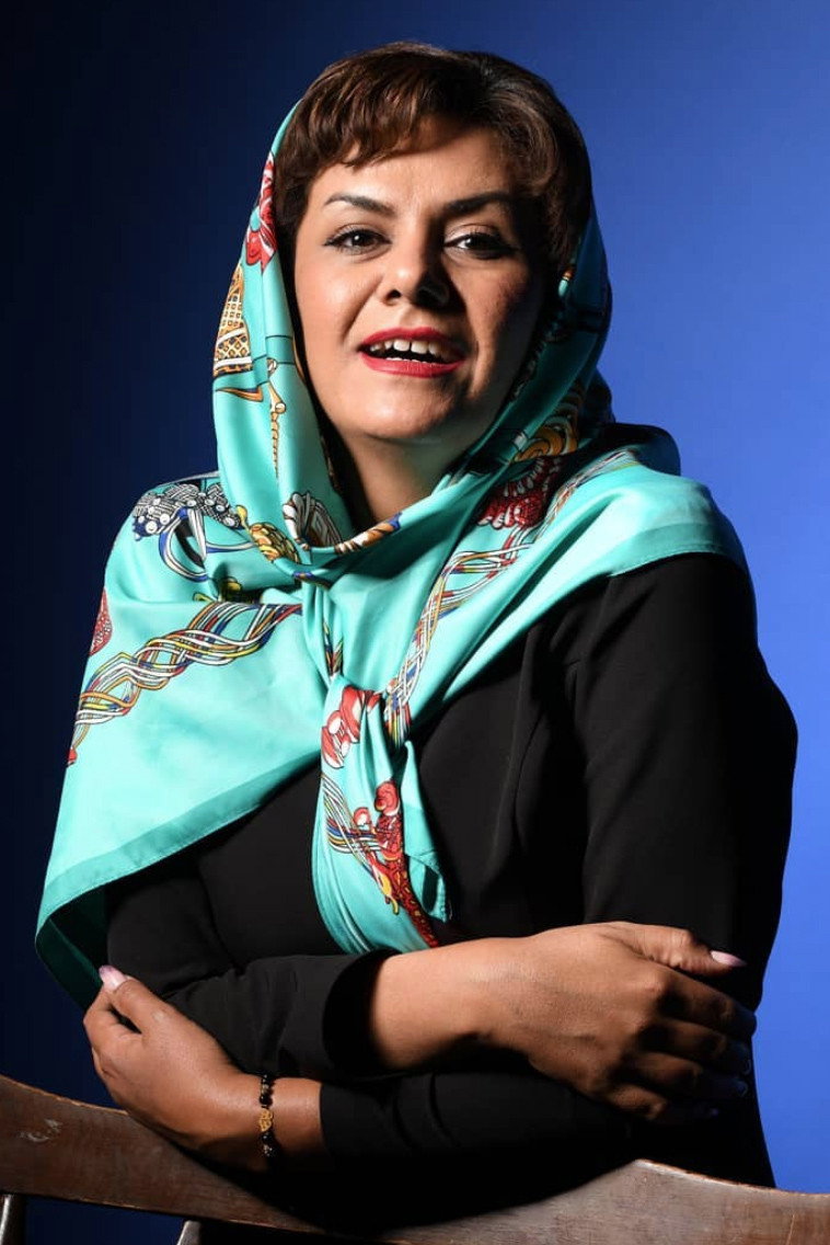 Marjan Ghamari as Reza Moradi's wife in Law of Tehran