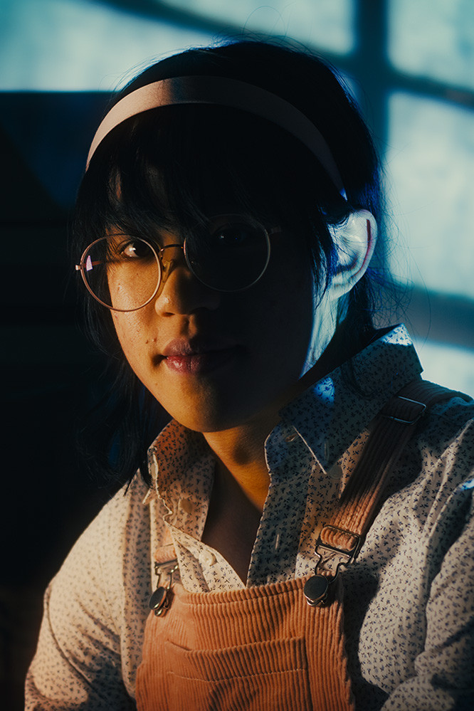 J.K. Wang as Various Townsfolk 2 in La Folie du Décret du Frère