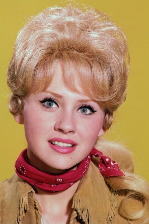 Melody Patterson as April Banner in The Angry Breed