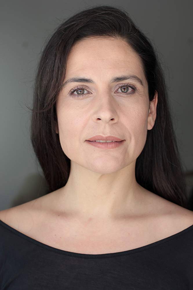 Saida Santana as Alex's Mother in The Girls at the Station