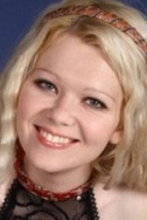 Elena Lebedeva as Elena, bank employee in -196
