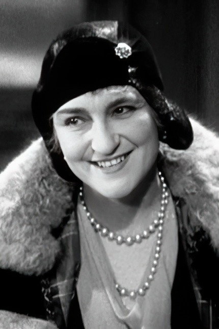 Violet Farebrother as Madame Charlustin in Contract to Kill