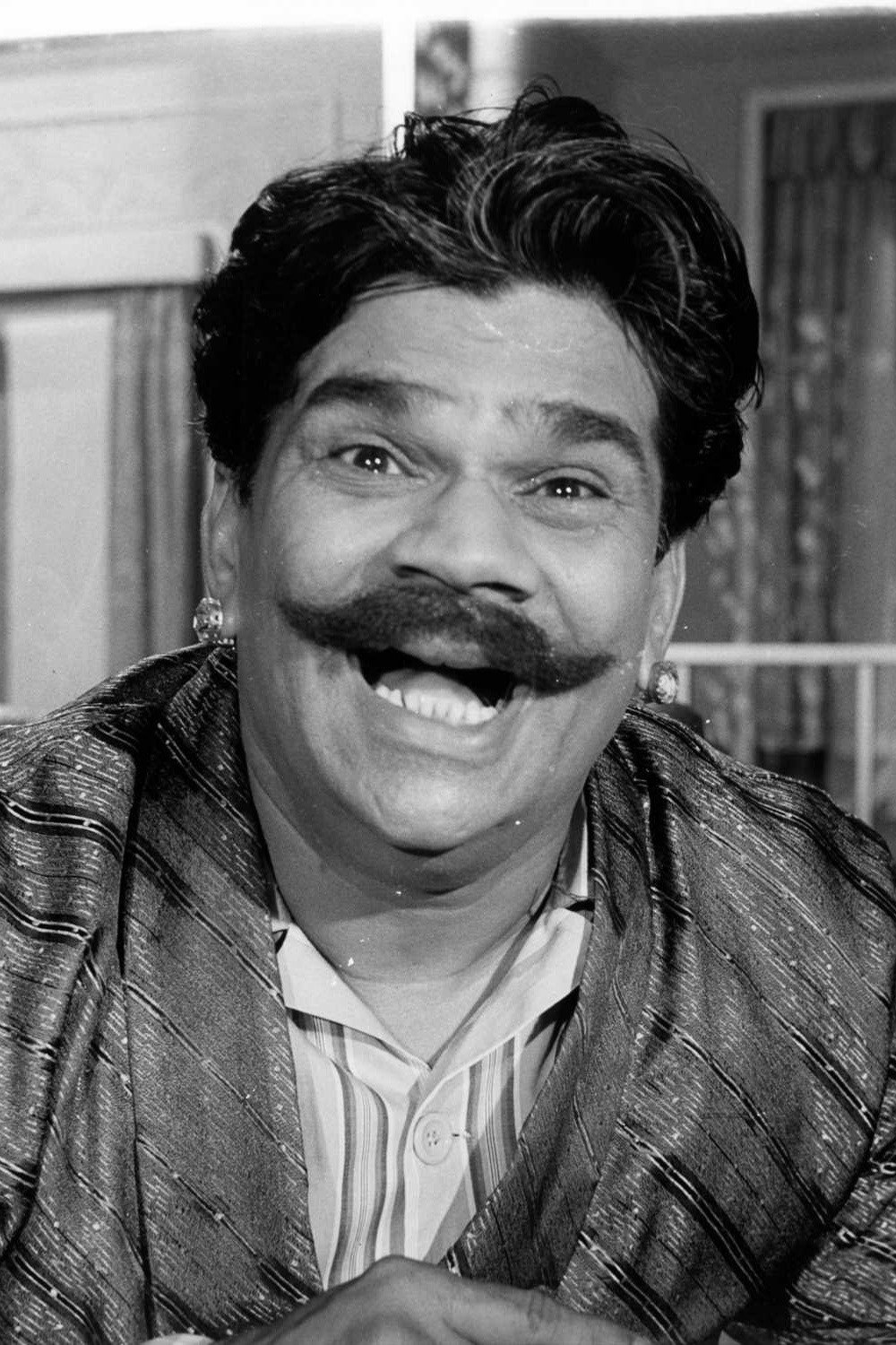 Dhumal as Hanuman Prasad in Holiday in Bombay