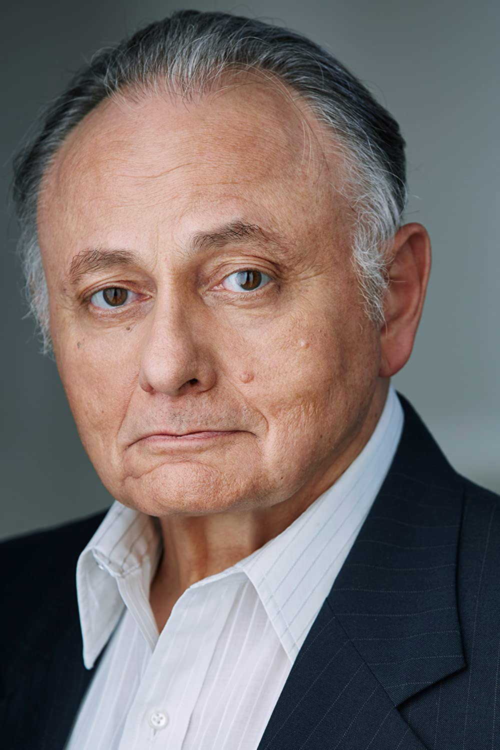 Carlos Barbouth as G. Amato in The 12th Annual On Cinema Oscar Special