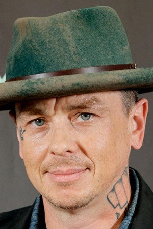 Sid Wilson as Self (archive footage) in Up to Our Necks