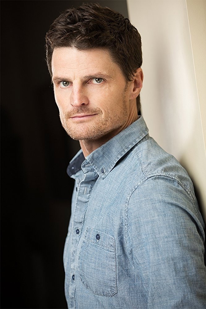 Bob Frazer as John Rayburn in Safehaven