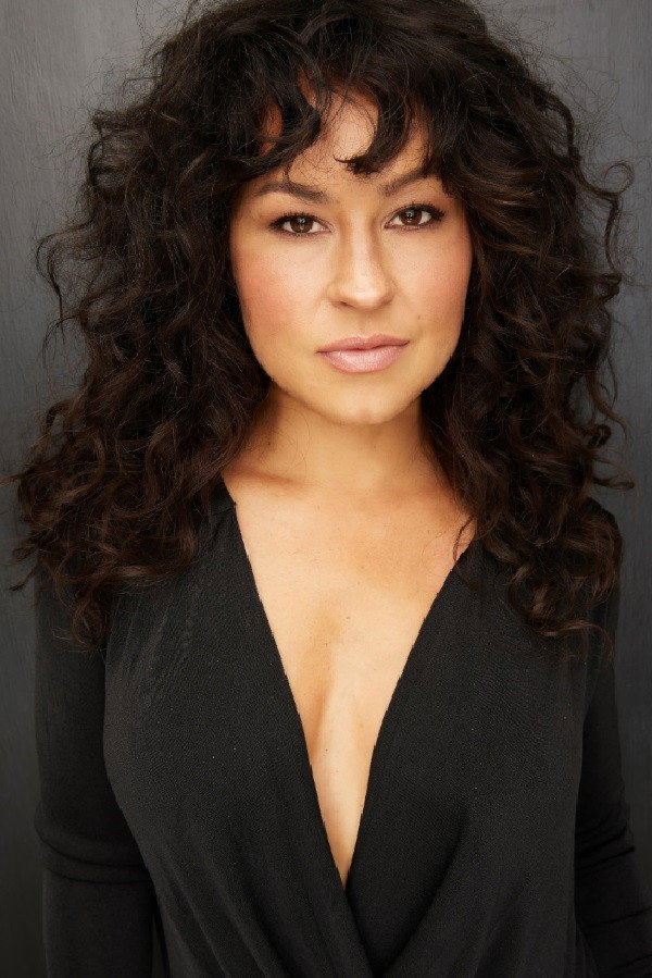 Cali Morales as Gloria in American Sicario