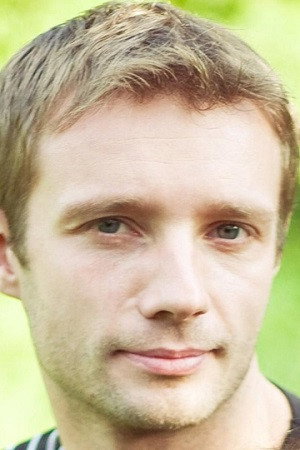 Evgeny Pekker as Nikolay Rusanovich in Michael Mil