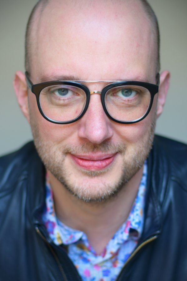 Raimund Berens as News Anchor (voice) in A Million Days