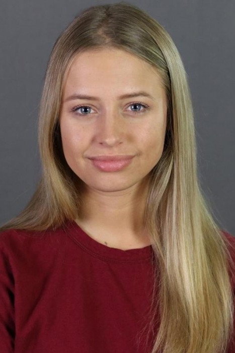 Lacey Cofran as Lorian West in Girl Next
