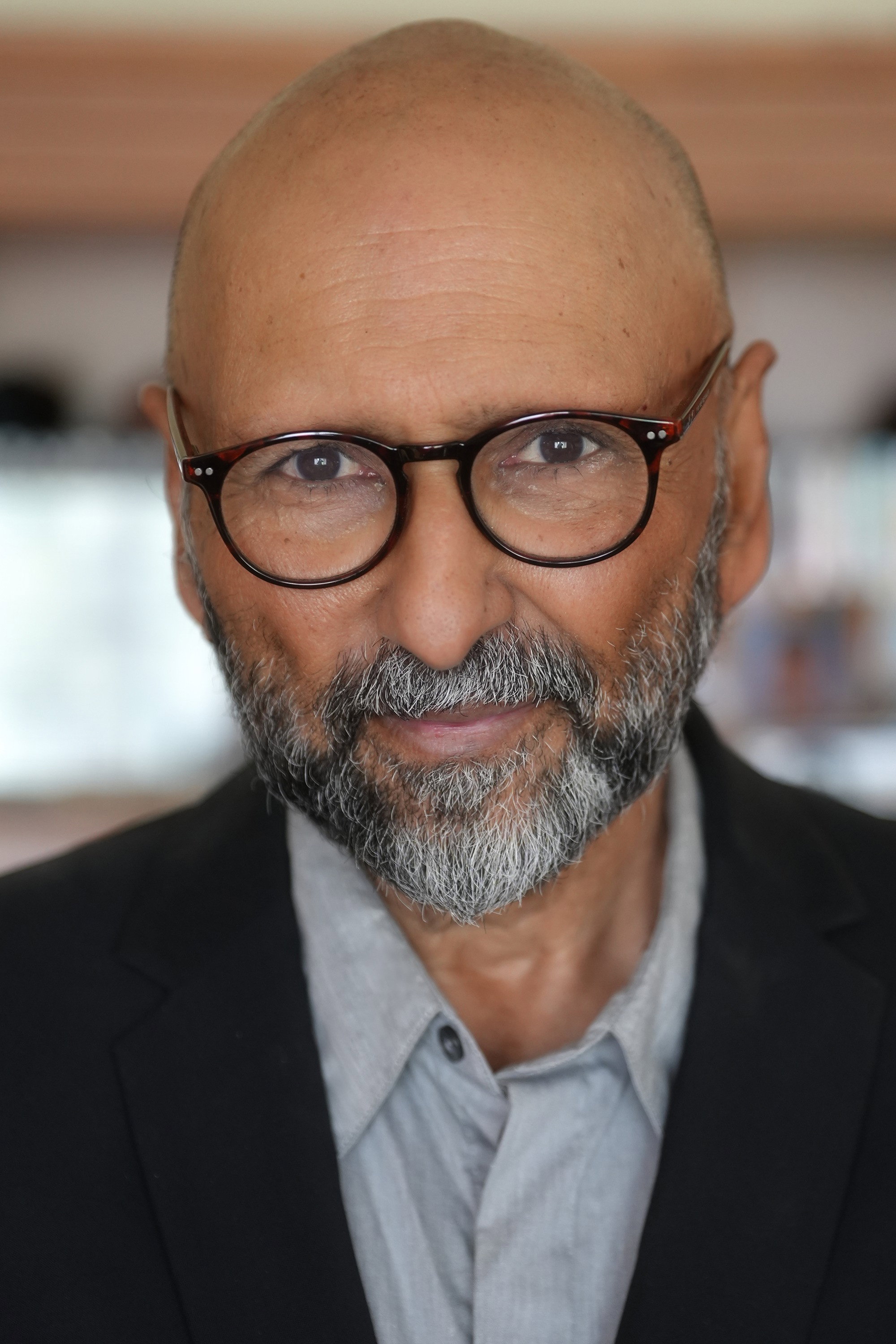 Kevin Mukherji as Ghosh in Premium Harmony
