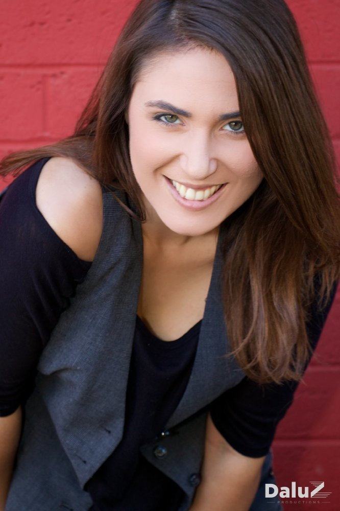 Kristin Naomi Garcia as TV Interviewer in Candy Apple