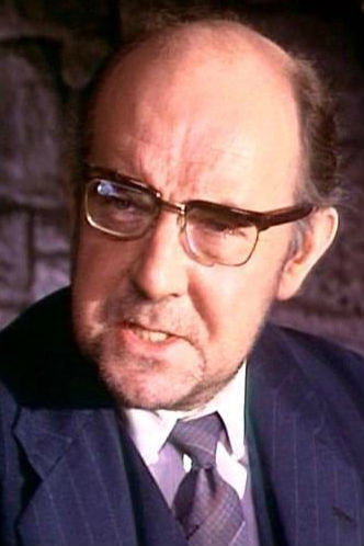 Redmond Phillips as Police doctor in Blind Date