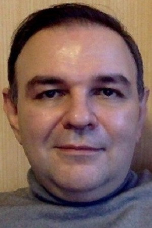 Alexandr Bokovikov as theater director in Pink Or Bell
