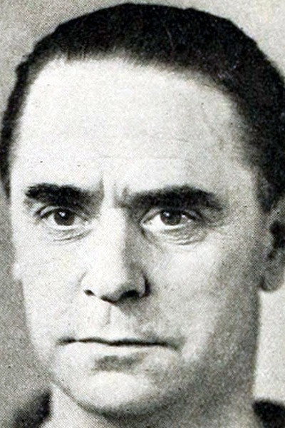 Henry Caine as Superintendent in The Secret