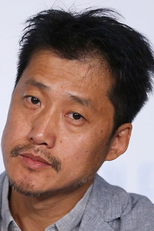 Liang Jingdong as Liang Jangjung in Mountains May Depart