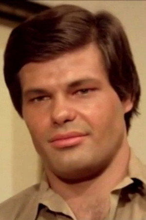 Eric Falk as Janosch Lassard in Blue Rita