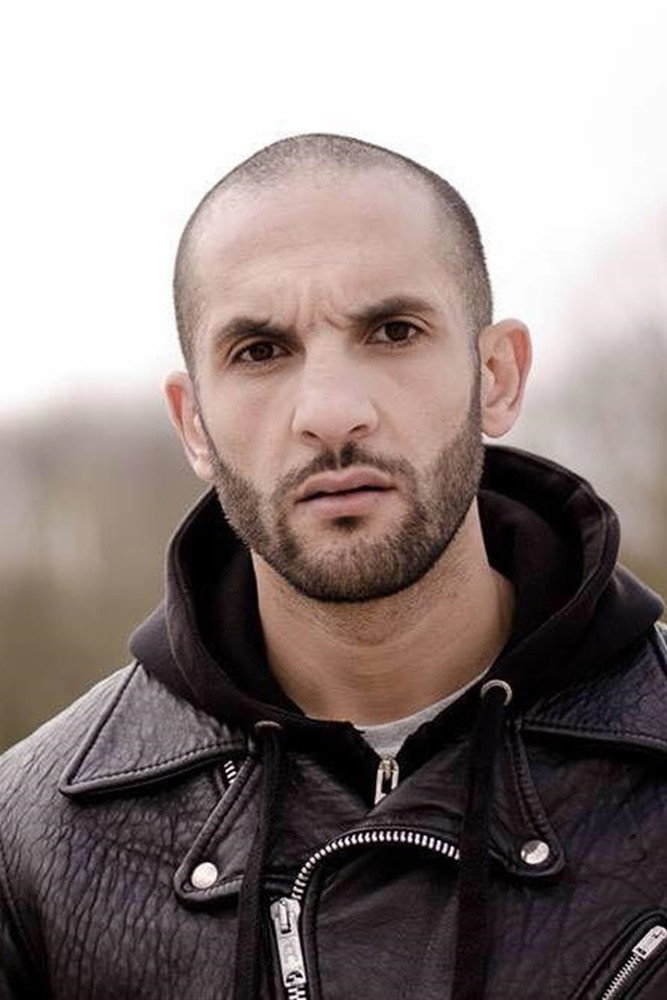 Saïd Benchnafa as Un prisonnier in Tout va bien