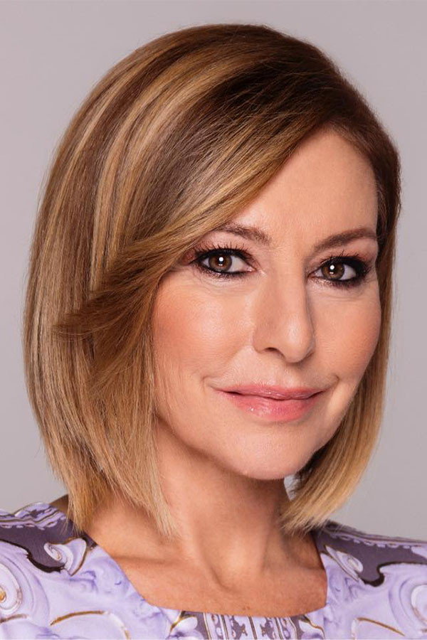 Antónia Erős as Newscaster in Impostor