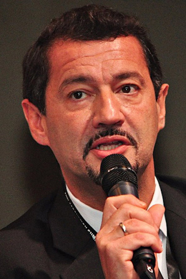 Xaiver Justo as Self - Whistle Blower / Former Director of Perosaudi, London in Man on the Run