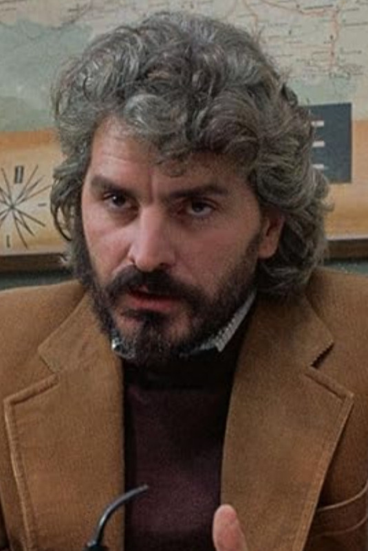 Mario Mattia Giorgetti as Carlo, Hippie in the Demonstration in Baba Yaga