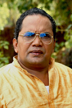 Shivaji Guruvayoor as Fr. George Kattuparamban in Velipadinte Pusthakam
