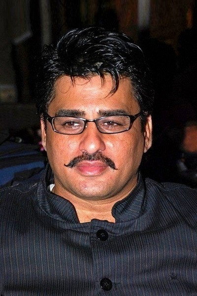 Ayub Khan as Rohini's Dad in The Family Vacation